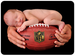 Unique newborn photographer in Northern VA.  Specializing in the "baby on football" picture for sports fans and athletes alike!